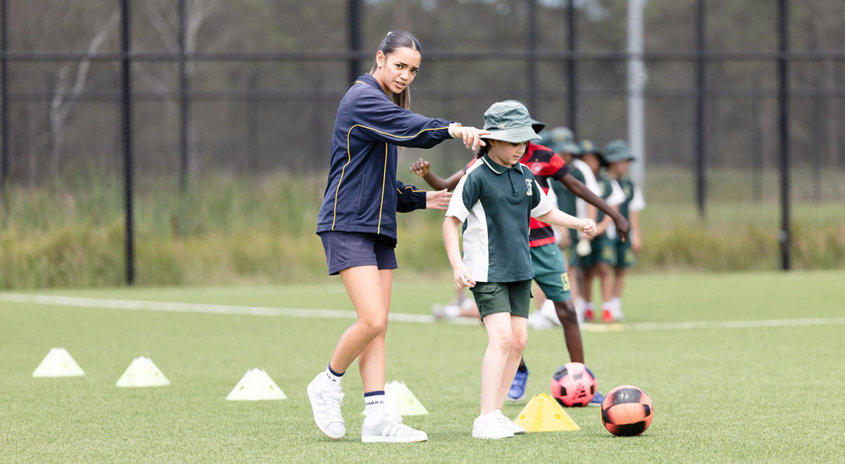 School students practising football